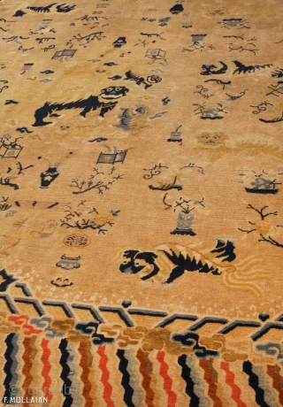 This is an antique Ningxia carpet from China and it was woven during the 18th century. It has a central foo dog and many more throughout the rest of the rug. It  ...