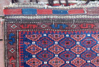 Baluch Pile Bag circa 19th century-- approx 24 × 24” --Repetitive small diamonds on indigo field. The “dollar sign” border is a rare feature used only by a small population of Baluchistan  ...