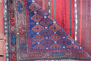 Baluch Pile Bag circa 19th century-- approx 24 × 24” --Repetitive small diamonds on indigo field. The “dollar sign” border is a rare feature used only by a small population of Baluchistan  ...