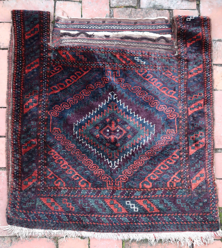 Sistan Baluch Khorgin Faces-- approx 29 × 30” 

Classic Sistan Khorgin faces with diamond medallion and piled side “bridges.” Thick and lustrous wool.

Ex James Douglas personal collection. Mr. Douglas was a scholar  ...