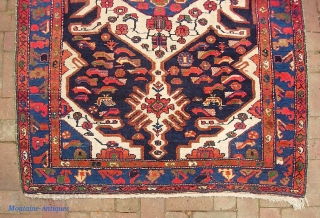 Bahktiari. 4 ft 5 inches by 6 ft 5 inches. Bold medallion rug with lots of ivory and great vivid color. Humans, birds, fish. Unusual green overcast on the sides appears to  ...