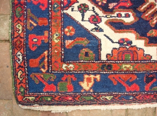 Bahktiari. 4 ft 5 inches by 6 ft 5 inches. Bold medallion rug with lots of ivory and great vivid color. Humans, birds, fish. Unusual green overcast on the sides appears to  ...