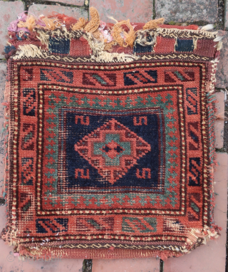  Baluch Chanta Khorgin Pair of Bags— approx 12 × 12”
 
Blue cross within diamond medallion. Well used little ethnographic textile.

Ex James Douglas personal collection. Mr. Douglas was a scholar and aficionado  ...