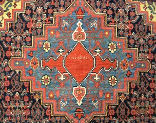 Senneh-- 4 ft 7 x 6 ft 7 in. Knockout colors. Typical fine knotting. Artistic and unique design. Appears to have some sort of scripting in the medallion. Maybe family signature. Pile  ...