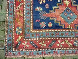 Kazak.  5 ft 2 inch x 8 ft-- Nice larger size. I think circa 1900 Period. Dynamic three medallion design and great colors. A bit of foundation spots-- mainly via brown  ...