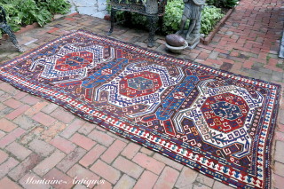 CAUCASIAN LENKORAN GALLERY RUG c. 19th cent--approx 4.6 x 9.6--Similar to Kazak but woven further east along the Caspian with dark weft and so-called Tosbaga (turtle) motifs--
Black oxidation mostly on far end  ...