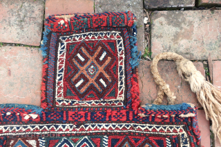 South Persian Salt Bag circa 19th century-- approx 15 x 19”

Sumak weave with white cotton highlights; also white cotton on striped back. Possibly Luri-Bahktiari.  Beautiful and unique piece. Ethno repair to  ...