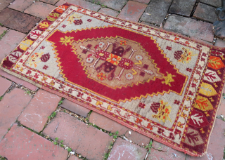 Turkish Yastik c. 19th cent-- approx 18 x 31 1/2”

Hearth medallion on red field with light blue corners. Interesting ethnographic piece with use-wear as shown. ($10 USA shipping)
     