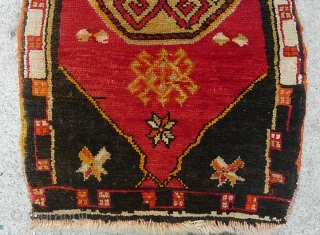 Yastik. 21 x 37 inches. A bold little rug with mystical design and some sort of script in the design, some synthetic colors.  $15 shipping in us.     