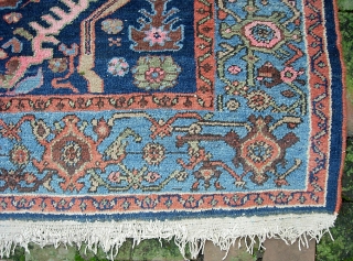 West Persian Tribal rug 4 ft 2 inches x 6 ft 0 inches. Can anyone identify this strange smiling animal? Looks like maybe a cat with a bird sitting on his shoulder??  ...