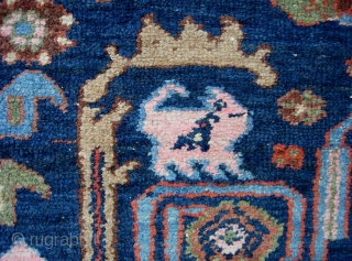 West Persian Tribal rug 4 ft 2 inches x 6 ft 0 inches. Can anyone identify this strange smiling animal? Looks like maybe a cat with a bird sitting on his shoulder??  ...