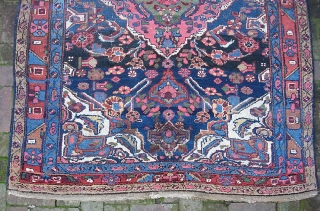 Kurdish. 4 ft 5 inches by 6 ft 5 inches.  Possibly from the Bidjar  area. Bold medallion design; terrific vegetable colors with lots of interesting abrashes. Original braided end weaves  ...