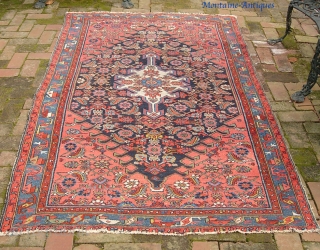 Hamadan. 4 ft 3 inches by 6 ft 8 inches.

Finely balanced medallion with really nice salmon corners. All natural dyes on this one. Decorative old piece that would look great with period  ...