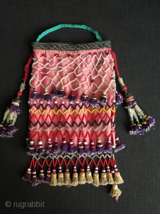 Uzbekistan small bag. Silk tassels and trade glass beads. Size: height with tassels 9.8" - 25 cm and width 5.5" - 14 cm.          