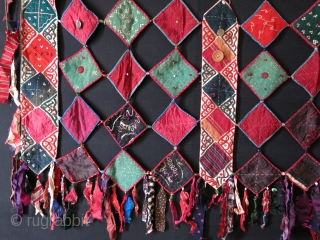 Ersary Turkmen asmalyk - yurt hanging. silk - cotton - wool square pieces put together with fabric tassels. decorated with coins and various buttons. Very good shape. Size : 36" X 25"  ...