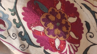 Antique Suzani fragment. Circa 19th Century. Professionally mounted on cotton fabric. Size: 9.8" x 50.6" 25 cm x 129 cm.             