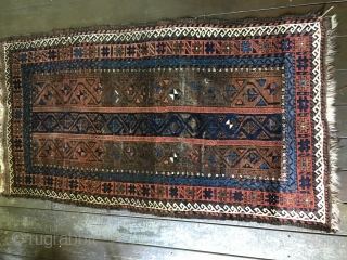 Antique Baluch rug circa late 19thC. Unique palette with field consisting of border designs. All natural colors including a brilliant light blue. Fair condition with areas of wear as well as places  ...