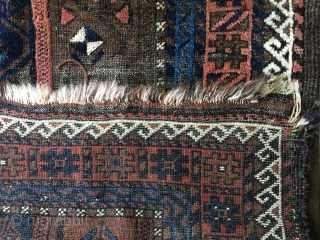Antique Baluch rug circa late 19thC. Unique palette with field consisting of border designs. All natural colors including a brilliant light blue. Fair condition with areas of wear as well as places  ...