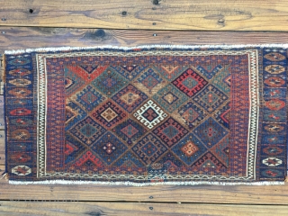 Early Jaf Kurd chuval fragment. Beautiful saturated natural colors that include a good variety of blues and blue-greens. Missing top and bottom borders.  Worn condition and with a patch from another  ...