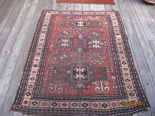 Late 19th C. Karabagh triple medallion rug. Unique geometric field design including rams horns. Low pile and some worn areas as shown, but complete with original selvedges. All natural dyes. Colors are  ...