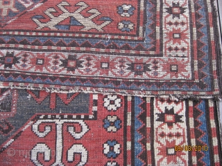 Late 19th C. Karabagh triple medallion rug. Unique geometric field design including rams horns. Low pile and some worn areas as shown, but complete with original selvedges. All natural dyes. Colors are  ...