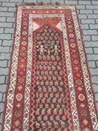 Antique Persian Bidjar runner with a lovelyl couple of Kurdish village people, signed and dated. Wool on wool foundation, size: 365x100cm / 12ft x 3'3''ft , little old moth damage at the  ...