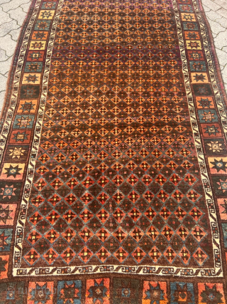 Antique Kordi rug from Khorassan province of Northeast Persia, good condition with full chunky pile. Glossy, shiny wool.  Its intricate design features a mesmerizing interplay of earthy brown tones, evoking a  ...