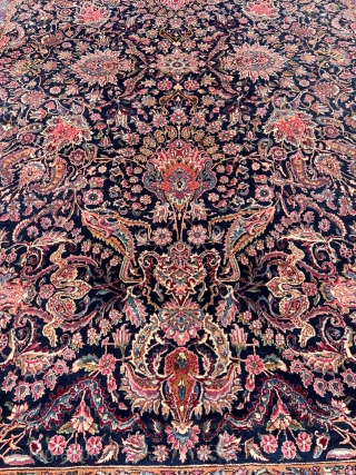 A highly decorative large antique Persian Kirman carpet, size: circa 520x345cm / 17’1ft by 11’3ft beautiful color combination, navy blue field color and a very well executed floral design. http://www.najib.de
   