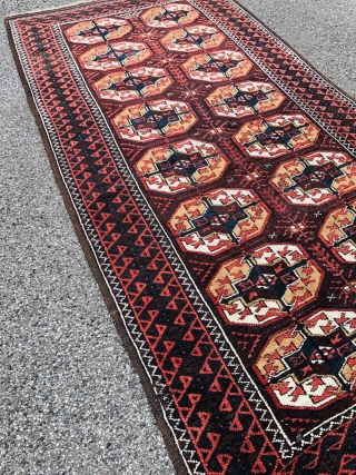 Antique Turkmen inspired Baluch rug with "Tekke Gul" design. Size: ca. 210x105cm / 7ft by 3'5''ft good overall condition, little old moth damage.          