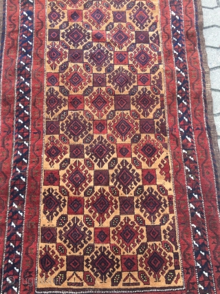 A very nice antique camel ground Baluch rug with saturated colors, shiny wool and a very well executed hooked design. The size is circa 170x90cm / 5'6''ft x 3ft    