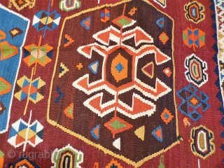 A remarkable antique Qashqai kilim with a dramatic design consisting of three large medallions, and the field filled with scattered motives throught.  The wool soft, shinny and finelly spun.In mint condition.  ...