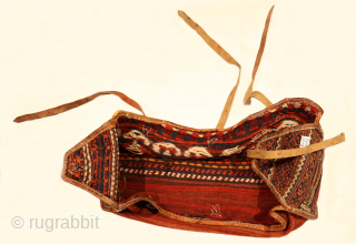 This antique Qashqai mafrash has been woven using only natural dyes. In mint condition. It is slightly smaller than the average Qashqai mafrash. We find this mafrash fascinating, since the back of  ...