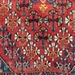 A Qashqai tribe rug with a central medallion, a central field full of floral bouquets, even the borders are arranged with flowers. All dyes are natural, achieving a pretty range of terracotas,  ...