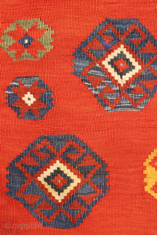 An exquisitely woven antique Qashqai kilim from southwest Iran. The central motifs, the emblem of the Qashqai tribe, is beautifully repeated across the rich terracotta field. The color transitions diagonally, creating a  ...