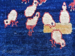 This family of free range chickens is happily living in this extremelly fine woven Persian rug, but are looking for a forever home (preferably vegetarian owners!). Great colours and shinny wool. 

62x60  ...