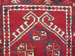 A soft, glossy and shinny prayer rug woven by ethic Uzbeks in Afghanistan. The 11 güls in the field are framed by a hooked Mihrab. The little "flowers" in the two white  ...