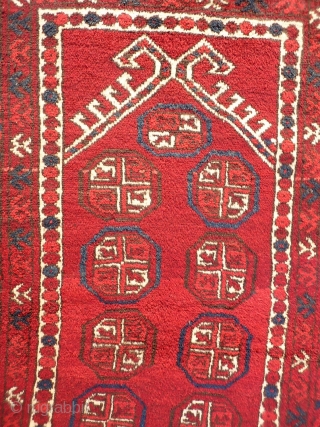 A soft, glossy and shinny prayer rug woven by ethic Uzbeks in Afghanistan. The 11 güls in the field are framed by a hooked Mihrab. The little "flowers" in the two white  ...