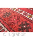 This prayer rug has a more formal border that constrasts with an unusual mihrab surrounded by two water jugs and randomly scatered motives. Tightly woven with nice shinny wool. The area where  ...