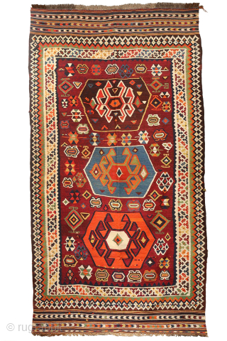 This highly collectible antique Qashqai kilim from Iran features a bold and captivating design. Made with top-quality natural dyes, it showcases rich, deeply saturated colors—including striking greens and blues—that sets it apart.

At  ...