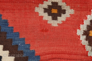 This antique kilim from the Qashqai tribe is woven from very finely spun and carded wool, thus creating a kilim of great precision. The center field has an "abrash" with spectacular color  ...