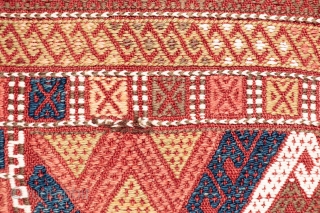 A kilim from the Obruk region, very finelly woven combining plain weave with cicim technique. The desing is composed of a well organised central field with two asimetric borders, both in terms  ...