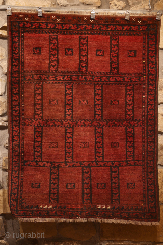 An antique Ersari Turkman squarish rug. This rug is woven with an unusual design of square compartments, each square having a set of leaves dividing the squares. The rug has some interesting  ...