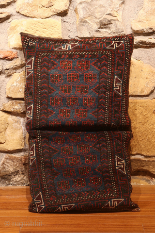 A fantastic antique balisht or pillow with a deep indigo field. A series of boteh motifs have been woven set against the blue background. The weaving is very fine, with a high  ...