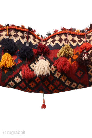 A hard to find Arabic baby craddle. This extraordinary little kilim was used as a hammock whilst the mother was weaving, cooking, tending the herds etc. The long tassels had a double  ...