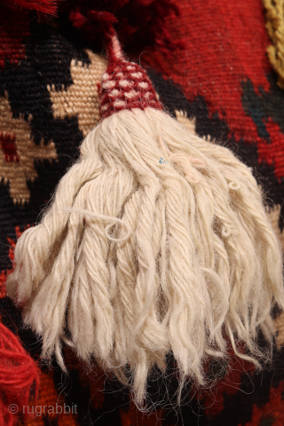 A hard to find Arabic baby craddle. This extraordinary little kilim was used as a hammock whilst the mother was weaving, cooking, tending the herds etc. The long tassels had a double  ...