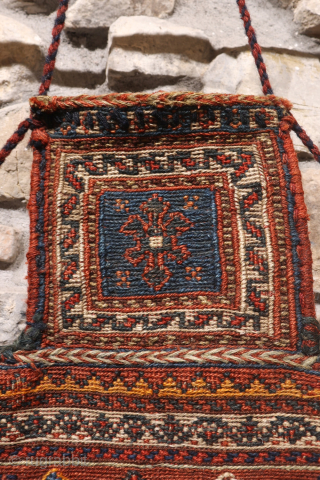 A superb antique Arab namakdan or salt bag woven with the soumak technique from Iran. All the dyes are natural, with a particularly beautiful indigo blue. The lower corners are probably worn,  ...