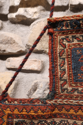 A superb antique Arab namakdan or salt bag woven with the soumak technique from Iran. All the dyes are natural, with a particularly beautiful indigo blue. The lower corners are probably worn,  ...