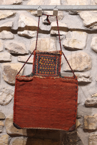 A superb antique Arab namakdan or salt bag woven with the soumak technique from Iran. All the dyes are natural, with a particularly beautiful indigo blue. The lower corners are probably worn,  ...