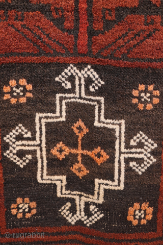 A very unusual design for this antique Baluch rug from Afghanistan. This rug from the 1920s sports a  surprising design with a central tree of life motif with camel caravans in  ...