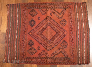 Iran Bakhtiari sofreh, 120x90cms, with soumak type embroidered  motifs on plain red ground, goat hair warp, remains of flour on rear face, authentic tribal weaving.       